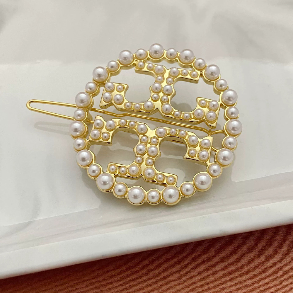 Tory Burch Inlaid Hollow Letter Geometric Round Metal Hair Clip